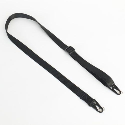 A black nylon webbing strap with black metal snap hooks on both ends and a black plastic buckle, laid out on a plain white background.