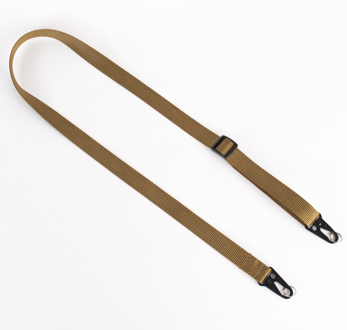 A tan nylon adjustable strap with black metal clips and black plastic slider, laid flat on a white background.