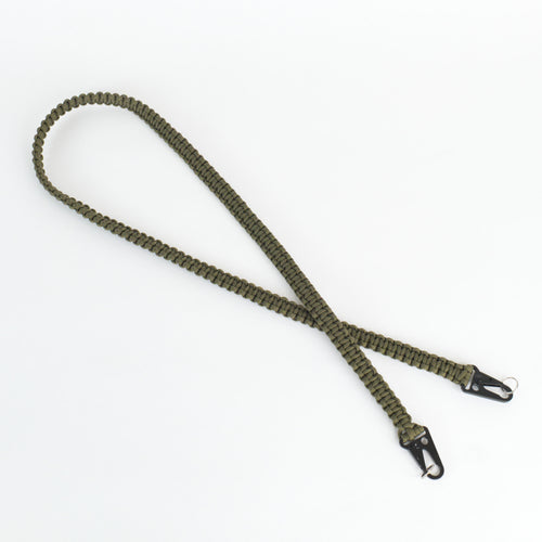 An olive green paracord shoulder strap with black metal snap hooks on both ends, laid out on a clean white background.