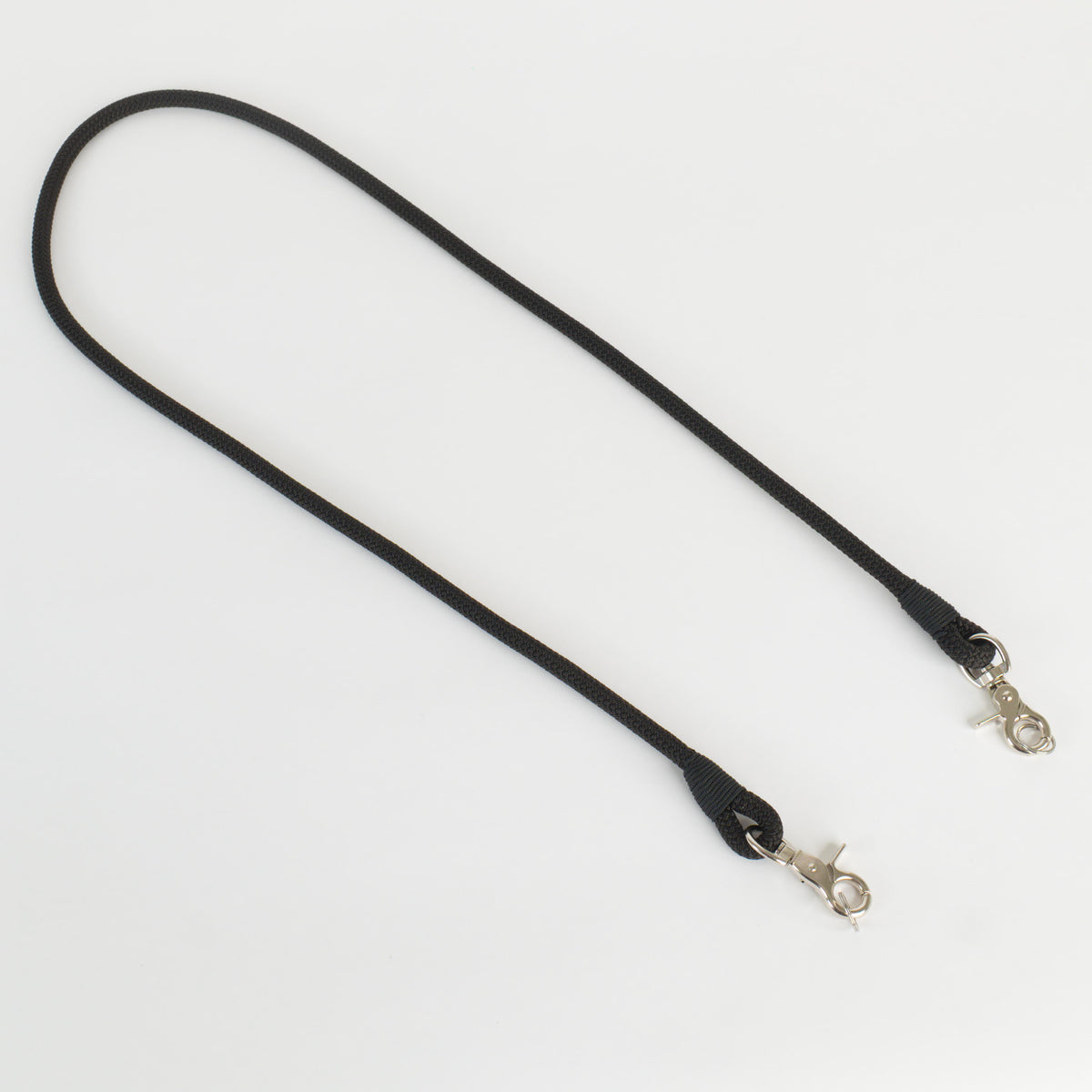 A black rope strap with silver metal snap hooks on both ends, displayed on a clean white background.