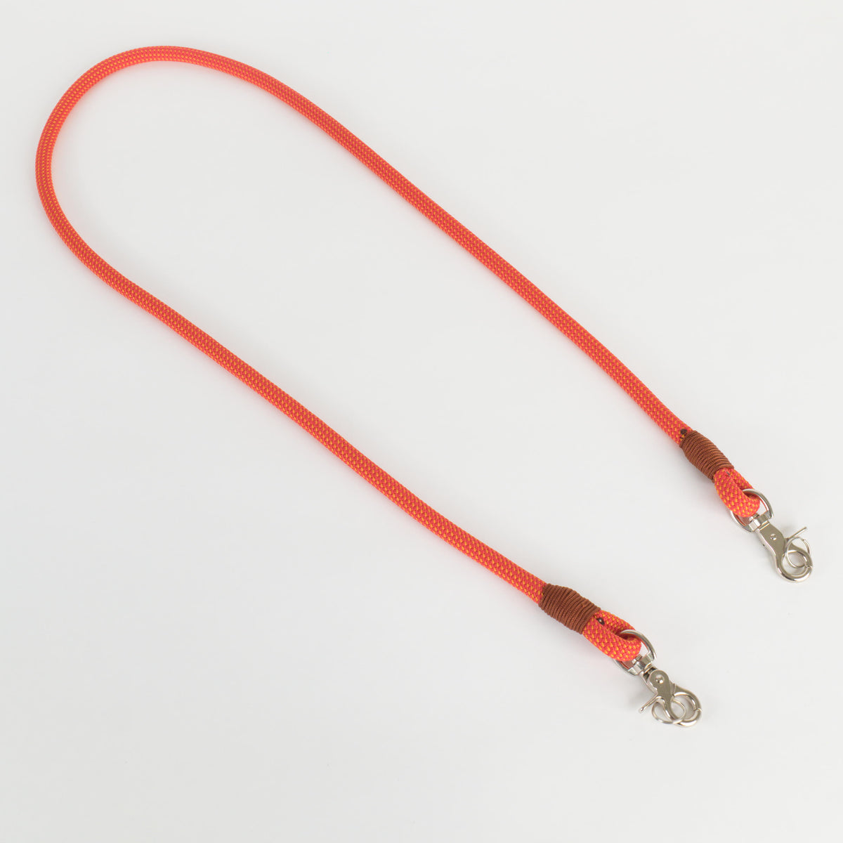 An orange rope strap with brown wrapped ends and silver metal lobster clasps, shown on a plain white background.