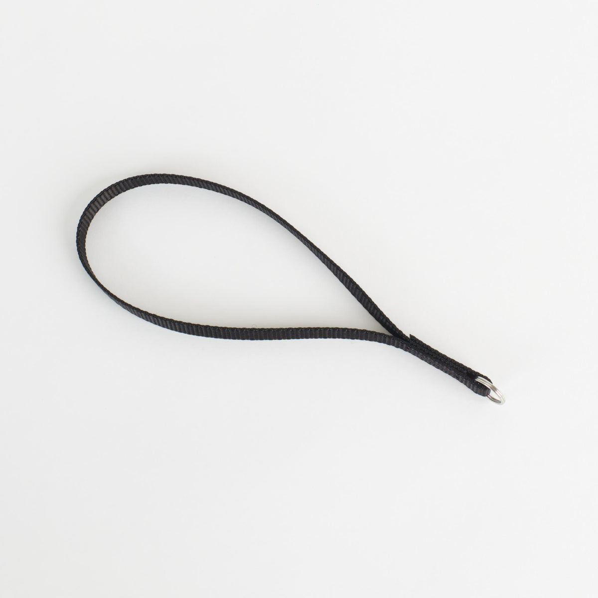 A black textured strap or loop with a silver metal split ring at one end, photographed on a clean white background.
